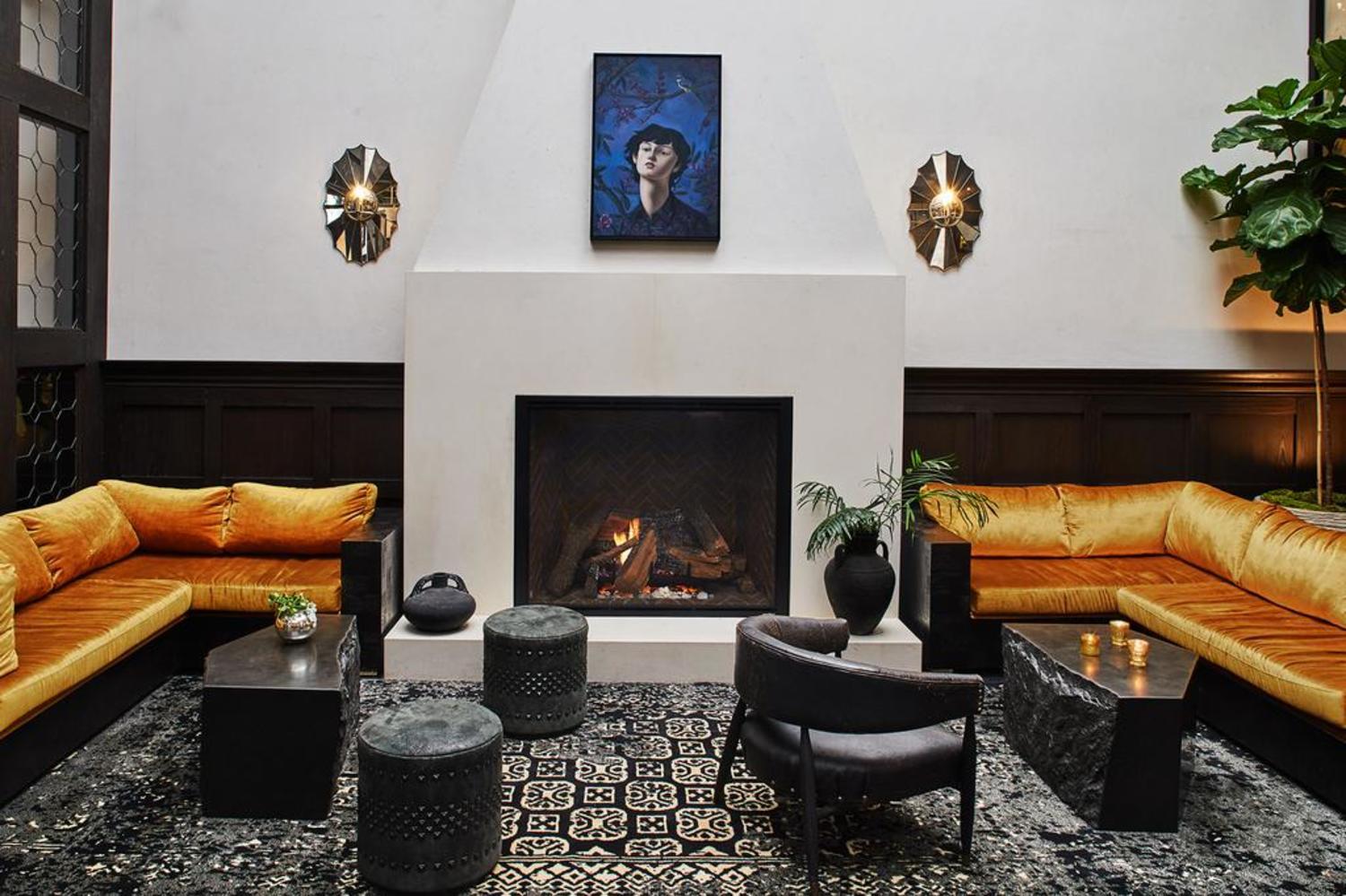 Hotel Figueroa, Unbound Collection By Hyatt Los Angeles Kültér fotó The fireplace at the hotel's lobby